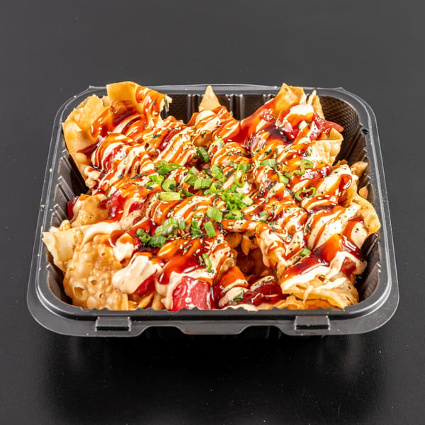 Generations Kitchen Hawaiian poke nachos with sauces and green onions in a black takeout container.