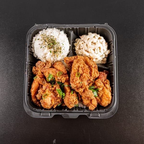 Generations Kitchen Hawaiian Food's fried chicken plate with rice and macaroni salad in a to-go container.
